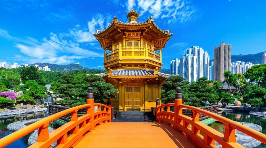 The Golden Pavilion Nan Lian Garden near Chi Lin Nunnery Temple in Hong Kong. The skies are blue with a few clouds