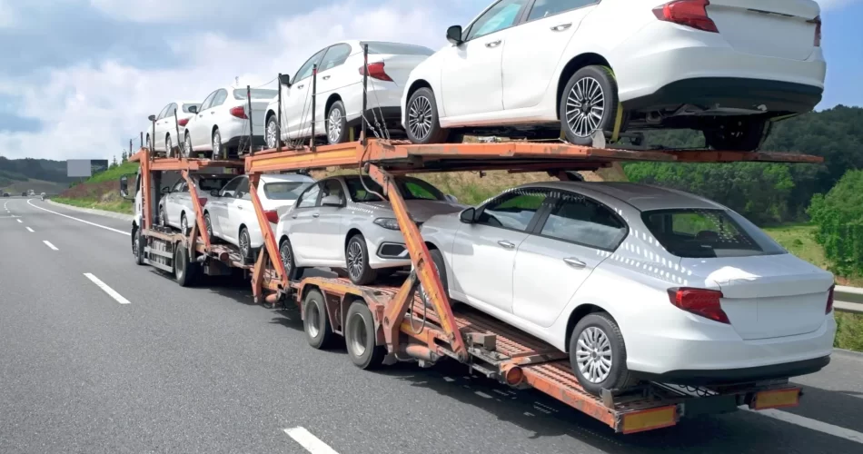 imported cars from Japan being transported by road