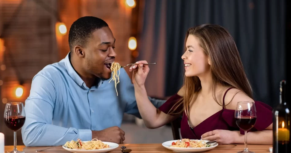 Couple feeding each other on a romantic date in Johannesburg